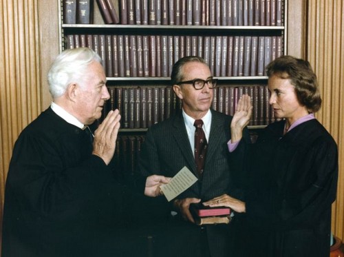 Sandra Day O'Connor Being Sworn in As Supreme Court Justice by Chief Justice Warren Burger, Her Husband John O'Connor Looks On [public domain] via National Archives and Records Administration