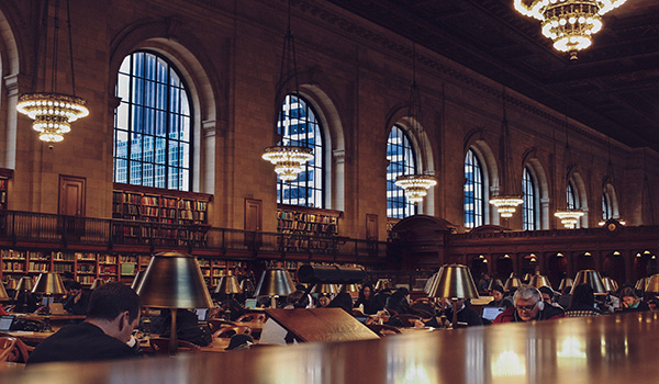 Researchers in library: Photo by Oscar Ovalle on Unsplash